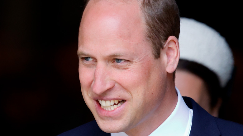 Prince William outside, smiling