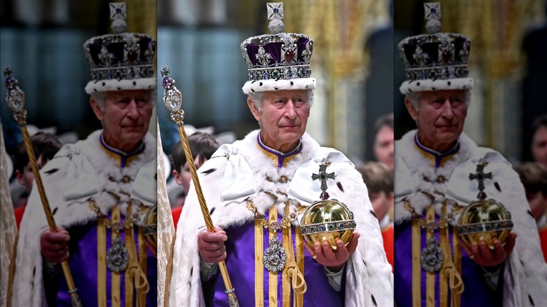 King Charles holds scepter and orb at coronation