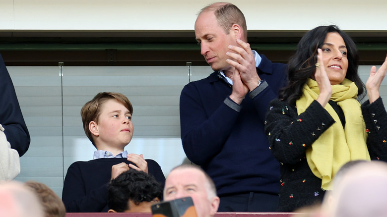 Prince William and Prince George clapping