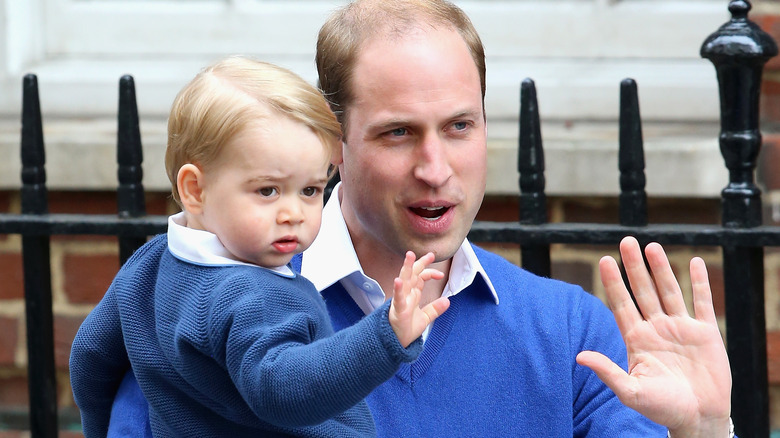 Prince William and baby George waving