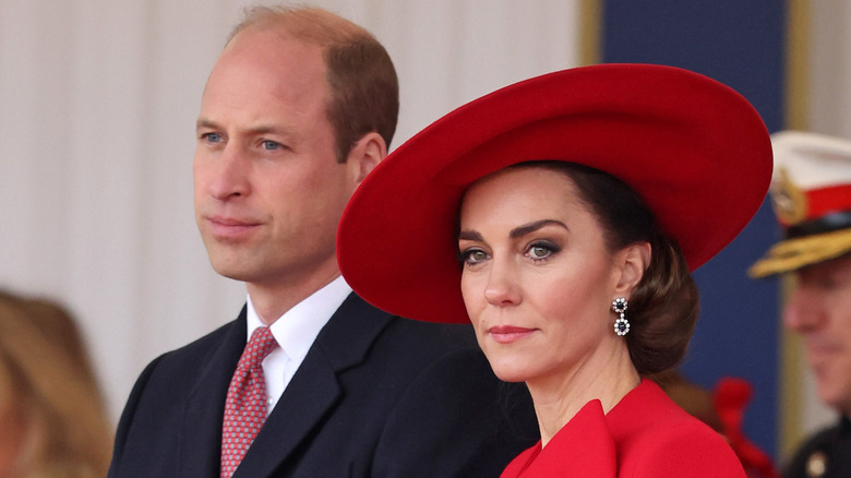 Prince William looking introspective and Kate Middleton looking serious