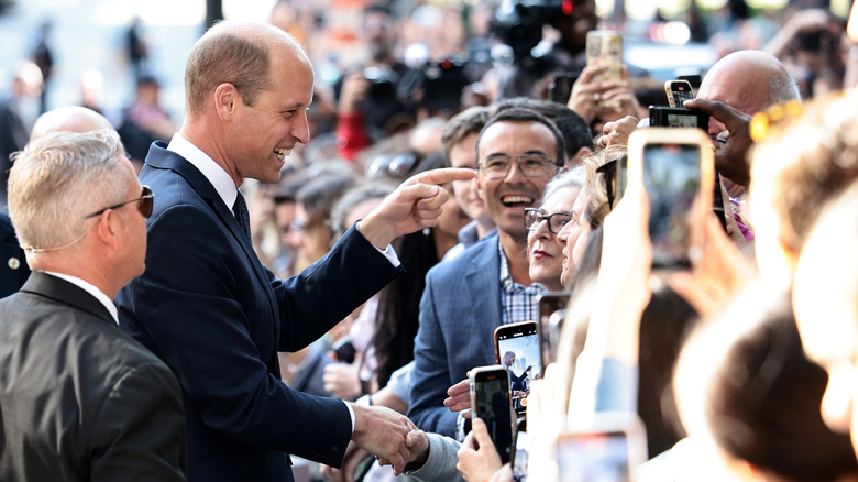 Prince William greeting fans