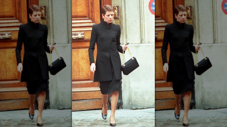 Princess Caroline walking in black suit