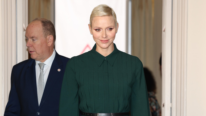 Princess Charlene walking with Prince Albert