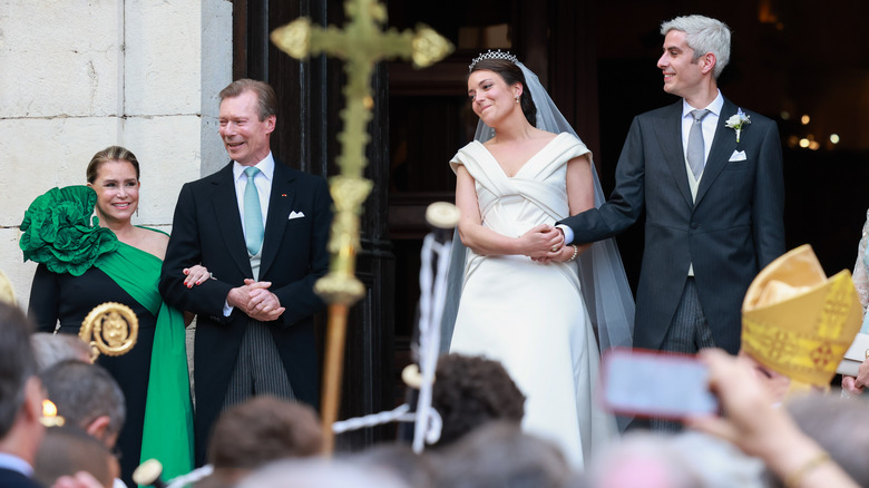 The bride's parents, Princess Alexandra, the groom outside church