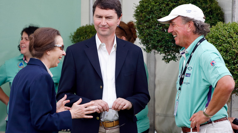 Princess Anne laughing with Sir Timothy Laurence & Mark Phillips