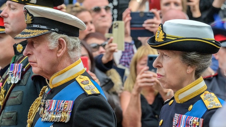 Princess Anne and King Charles standing together