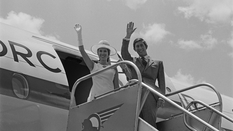 Princess Anne, Prince Charles waving by airplane