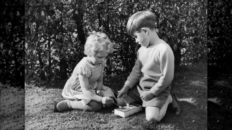 Princess Anne and King Charles playing together as kids