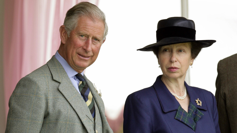 King Charles and Princess Anne standing together