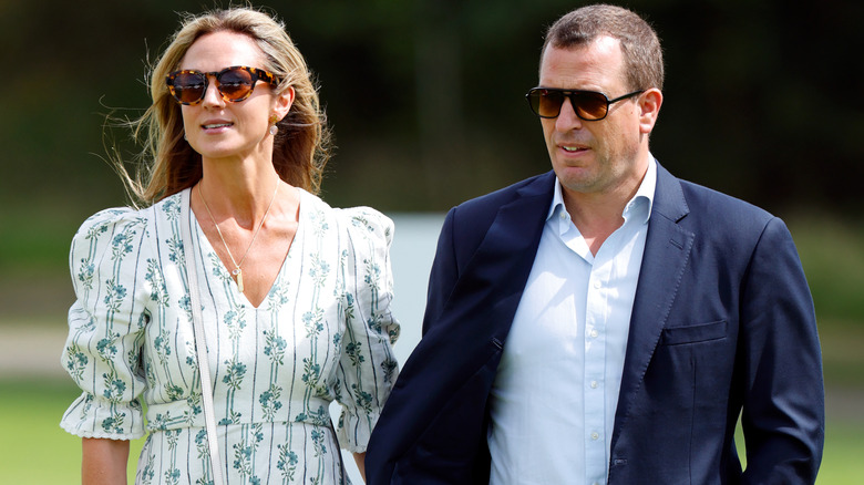 Harriet Sperling and Peter Phillips walking together