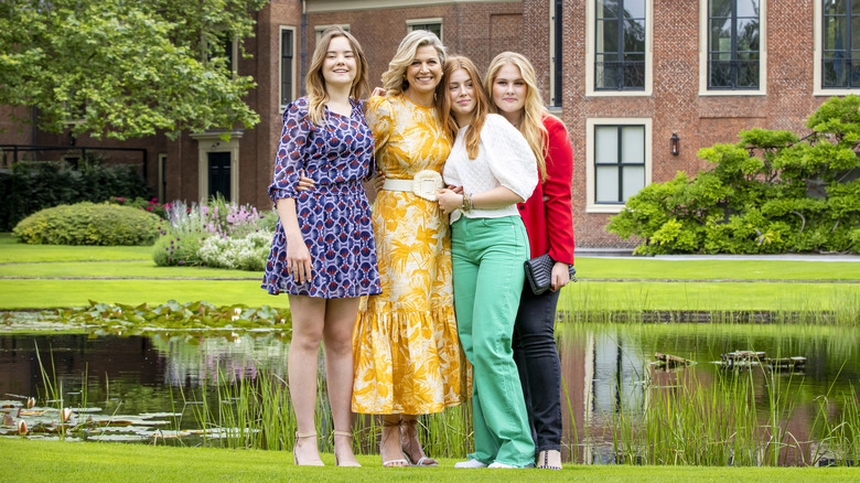 Queen Máxima and her daughters posing outside