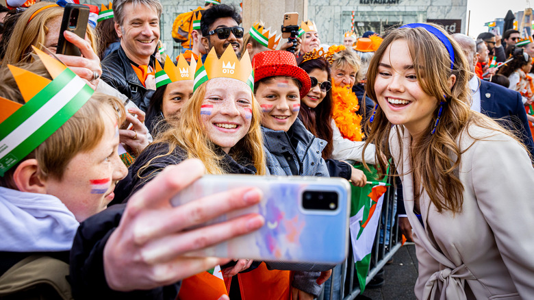 Princess Ariane posing for selfie with fans