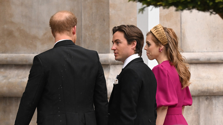 Princess Beatrice walking with husband & Prince Harry