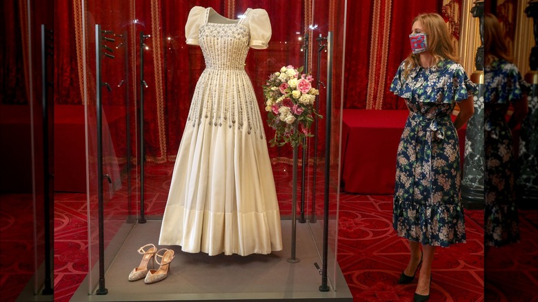 Princess Beatrice beside her wedding dress