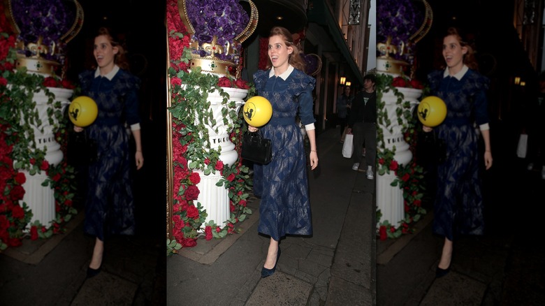 Princess Beatrice posing in a blue dress