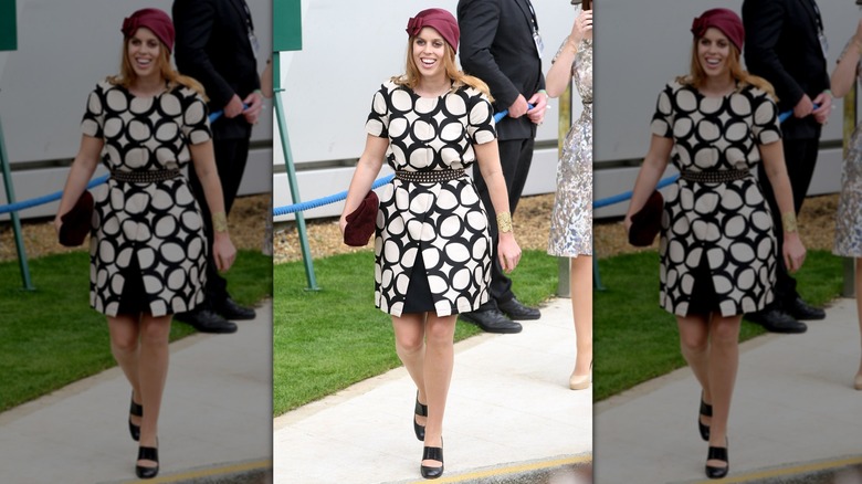 Princess Beatrice smiling while walking