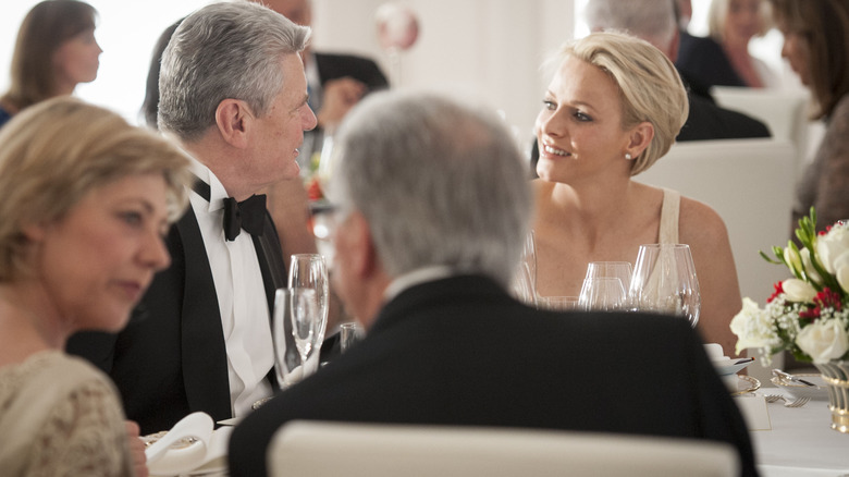 Princess Charlene talking during dinner