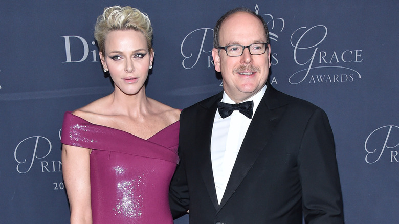 Princess Charlene of Monaco and Prince Albert II smiling 