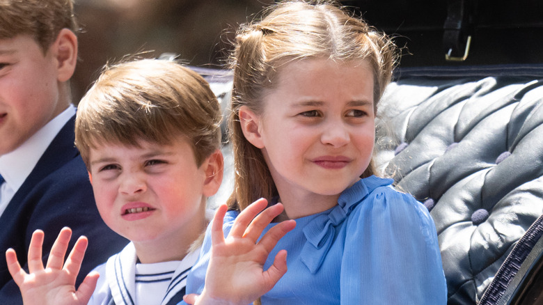 Prince Louis and Princess Charlotte waving