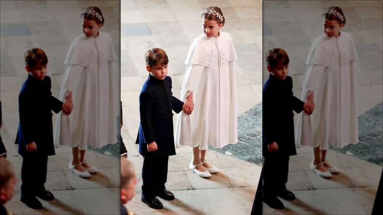 Princess Charlotte holding Prince Louis' hand  