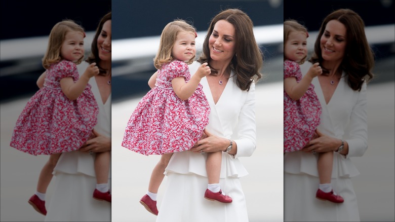 Princess Catherine holding Princess Charlotte 