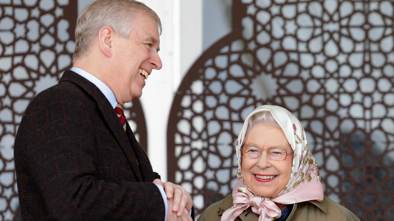 Prince Andrew and Queen Elizabeth talking and smiling