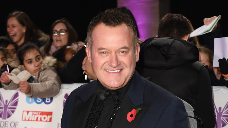 Paul Burrell smiling at an event