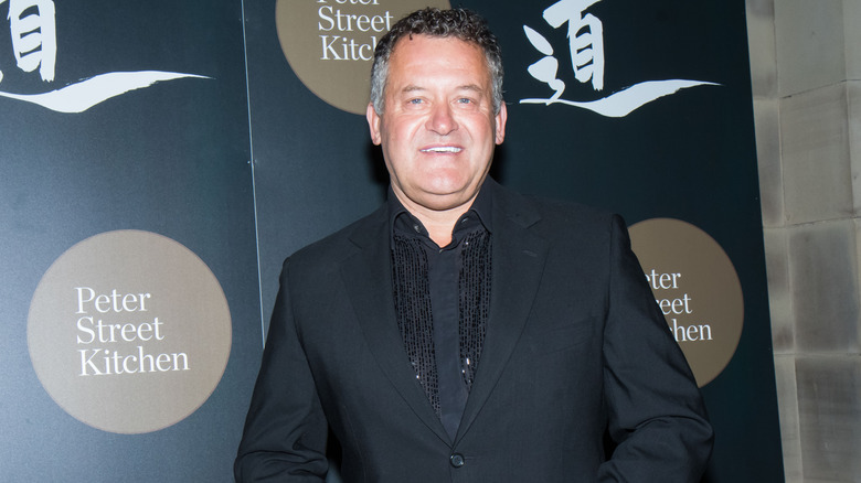 Paul Burrell smiling at an event