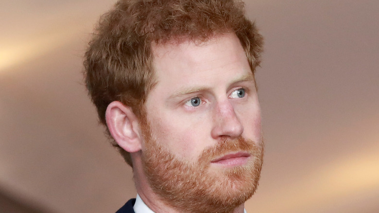 Prince Harry looks pensive at an event