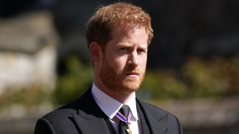 Prince Harry looks pensive at an event