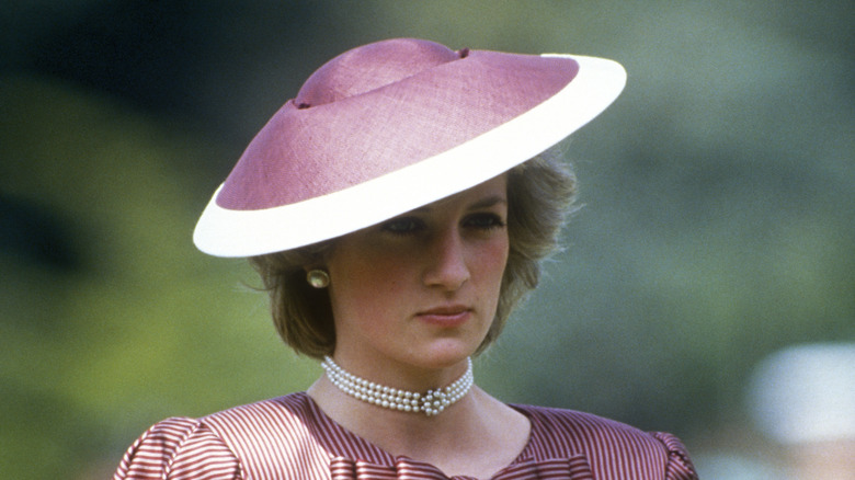 Princess Diana wearing purple hat 