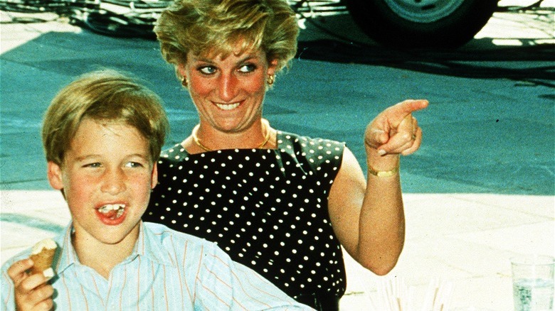 Princess Diana pointing and laughing with William