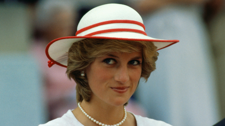 Princess Diana knowing look in a hat 