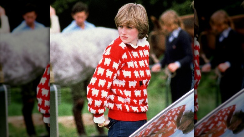 Princess diana in red sheep sweater in front of horse