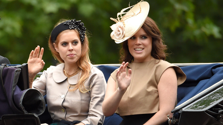 Princess Eugenie and Princess Beatrice waving