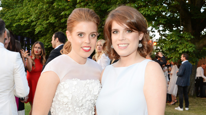 Princess Beatrice and Eugenie smiling