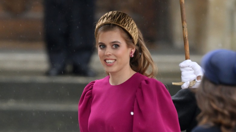 Princess Beatrice smiling, walking