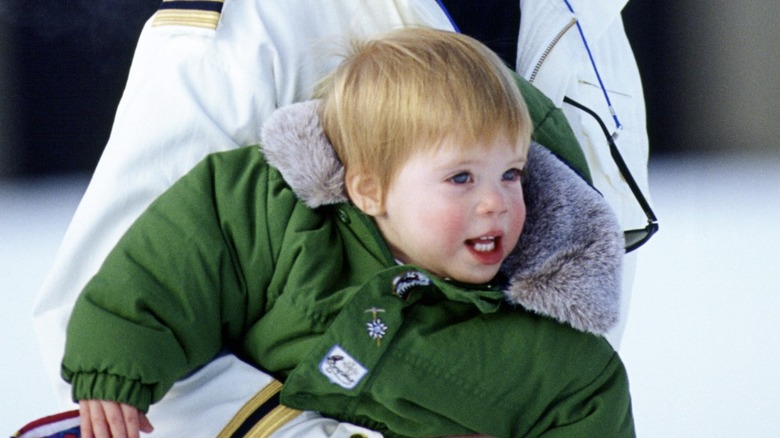 Princess Eugenie as a baby in her mother's arms