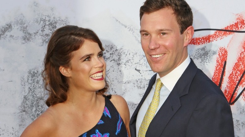 Princess Eugenie smiling at Jack Brooksbank at event