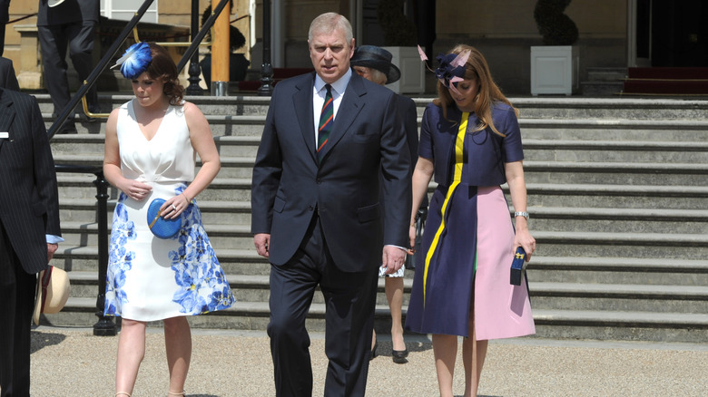 (L-R) Princess Eugenie, Prince Andrew, and Princess Beatrice in 2016