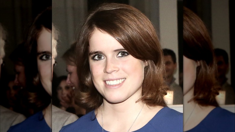 Smiling Princess Eugenie wearing dark eyeliner at the 2014 Faberge Big Egg Hunt Cocktail Countdown