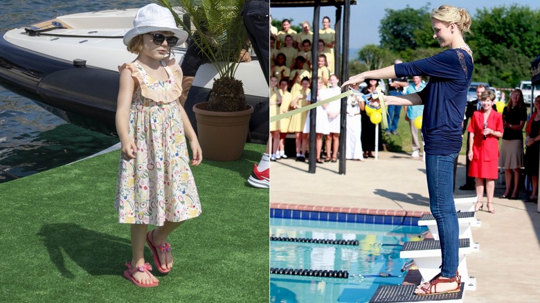 Princess Gabriella and Princess Charlene pose near water