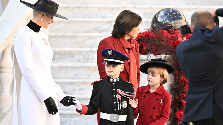 Princess Charlene standing with Jacques and Gabriella on Monaco Day