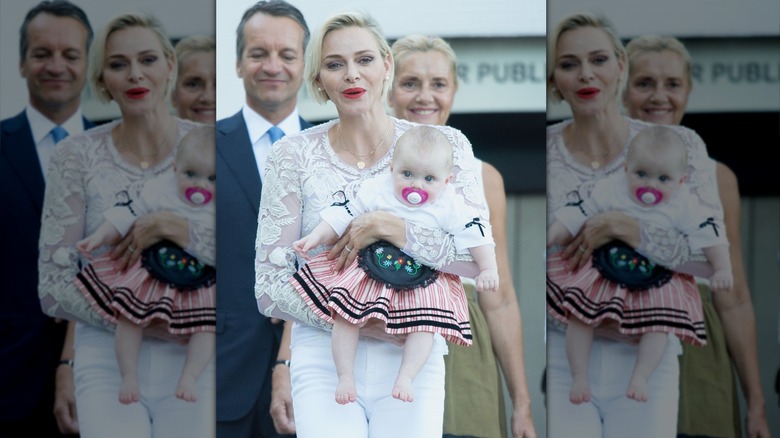 Princess Charlene holds the baby Princess Gabriella