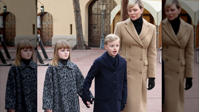 Princess Charlene looks at Princess Gabriella and Prince Jacques as they walk in Monte Carlo