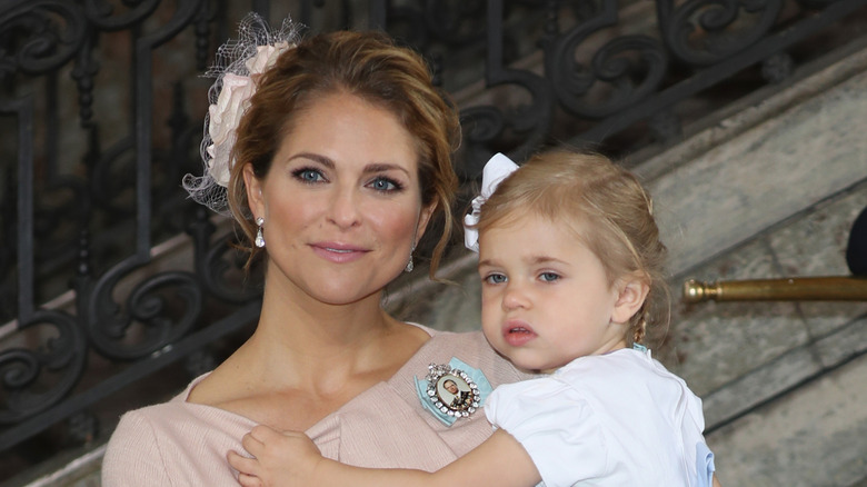 Princess Madeleine and Princess Leonore of Sweden pose for photos after the christening of Prince Oscar of Sweden at Royal Palace of Stockholm in Sweden (2016)