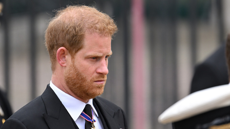 Prince Harry at the coronation, looking down