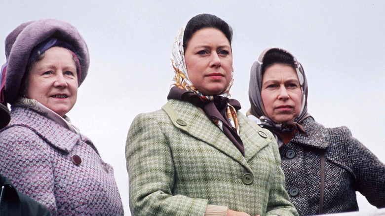 Margaret with her sister and mother, all looking on