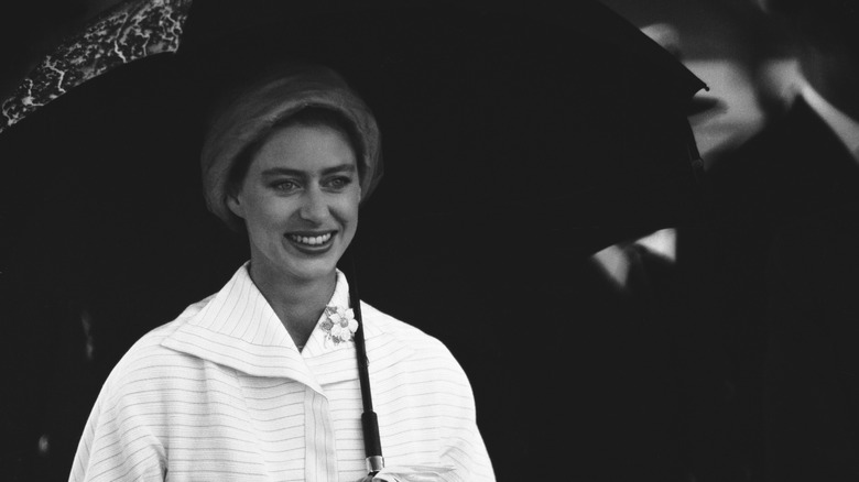 Princess Margaret holding umbrella